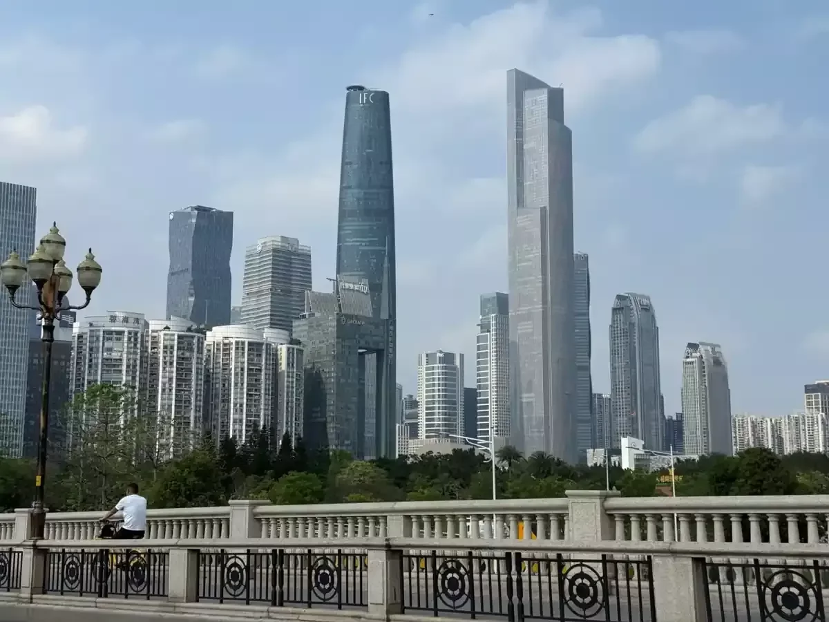 Daytime view of Guangzhou's CBD skyline featuring IFC Tower and surrounding buildings