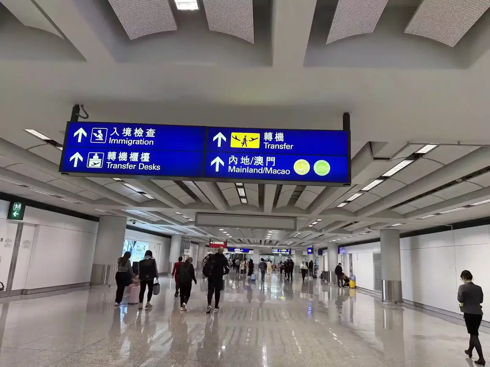 Signage for Mainland/Macau and Transfer directions inside Hong Kong Airport