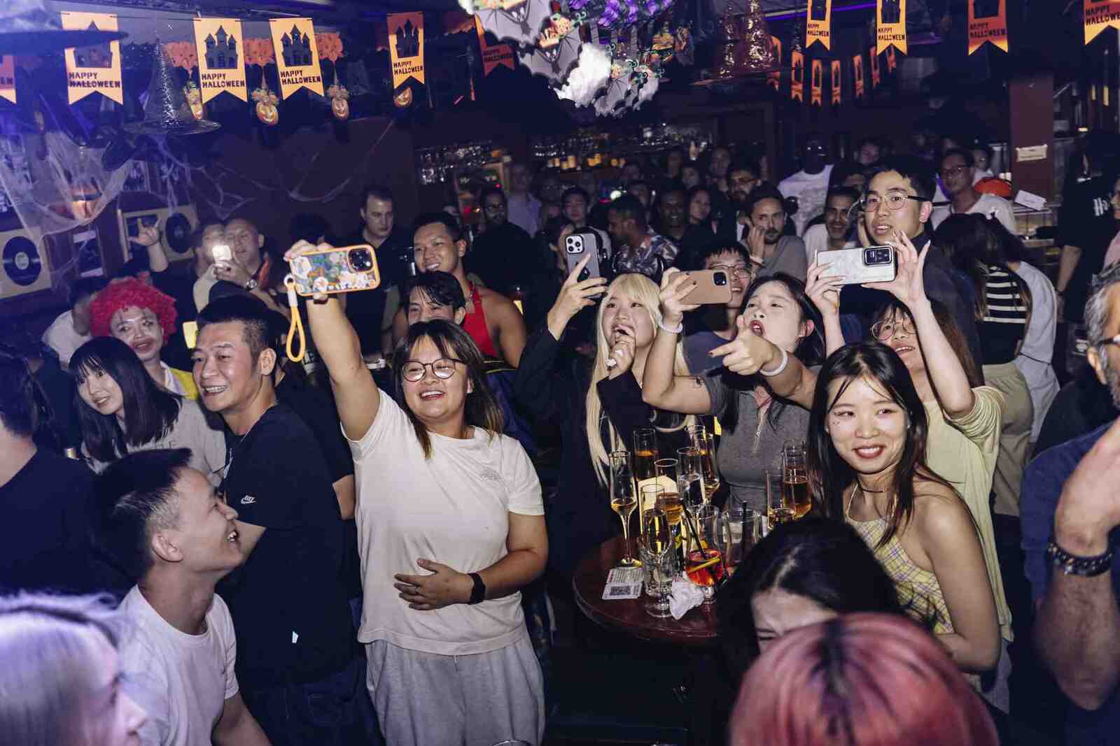 Group of friends celebrating at Hooley's Irish Pub Guangzhou.