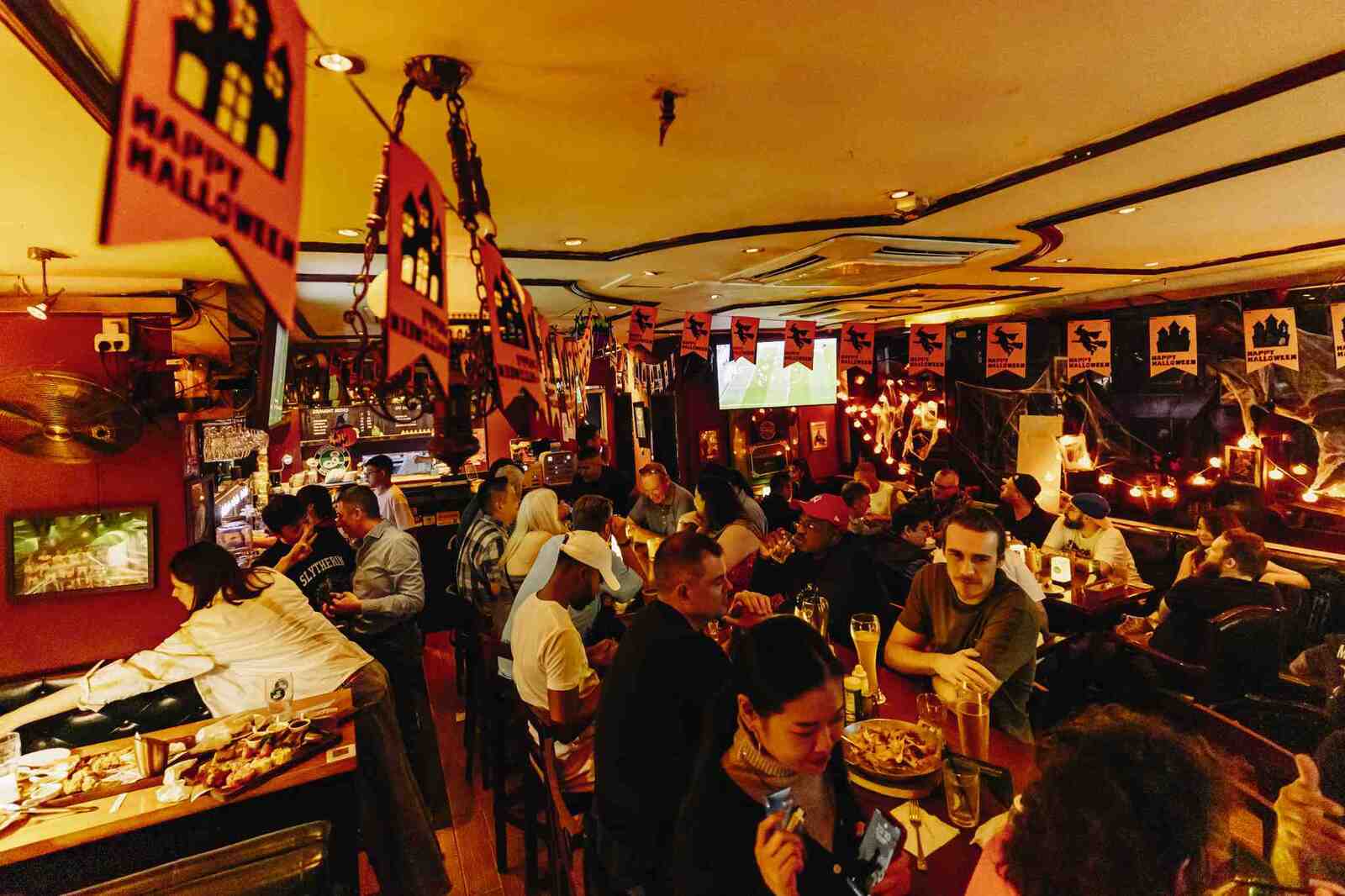 Excited crowd celebrating Halloween at Hooley's Guangzhou.