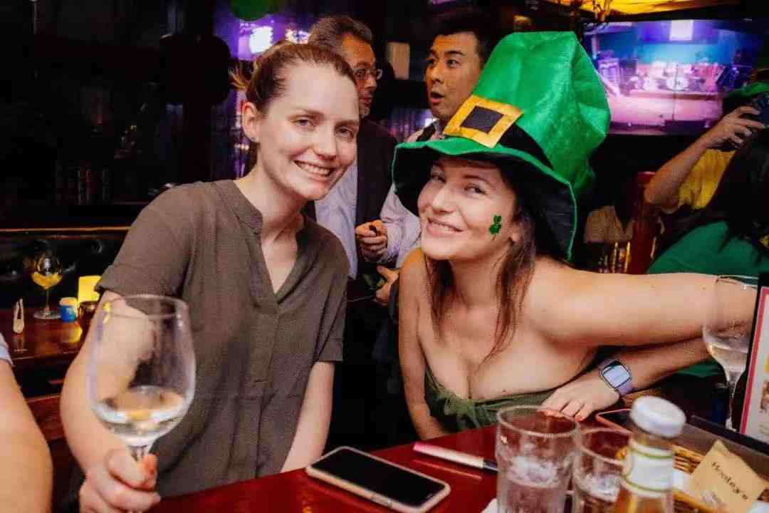 Two women celebrating St. Patrick’s Day at Hooley's Guangzhou.