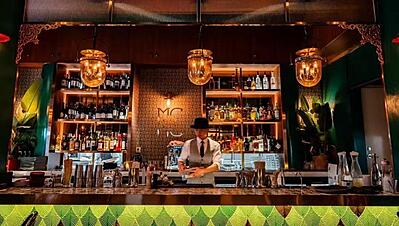 The lively atmosphere at MBC Pub in Guangzhou, featuring a vibrant international crowd, premium drinks, and delicious gastropub food.